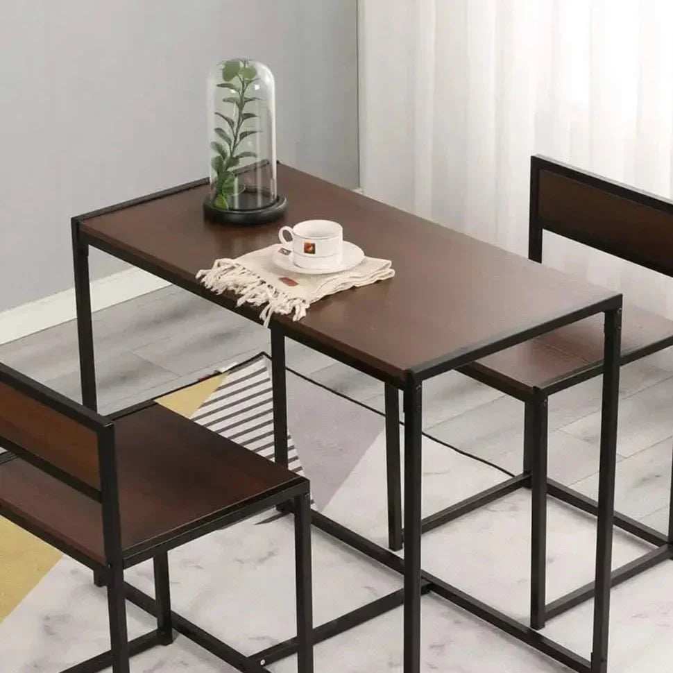 ترابيزة سفرة ستيل بمقاسات 90 50 75 سم بسطح خشبي بني غامق وإطار وأرجل معدنية سوداء بتصميم صناعي بسيط